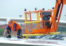 Knikarmhoogwerkers op wielen JLG 740 AJ