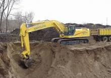 Rupsgraafmachines New Holland EC450